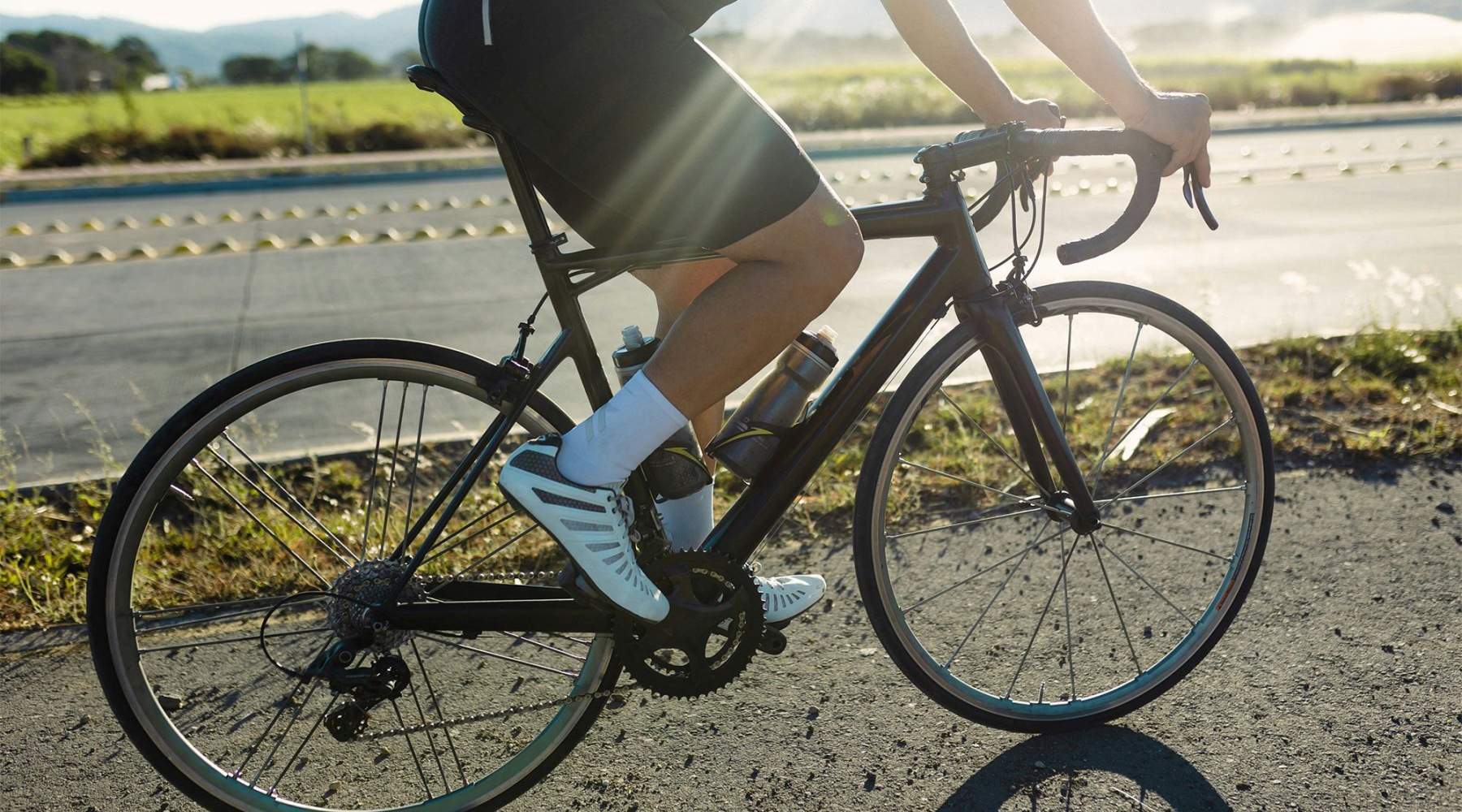 a man riduing his bicycle outside